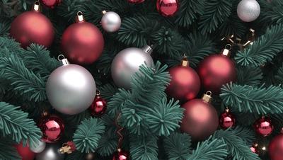 The primary subject of the image is a Christmas tree adorned with ornaments. The tree is surrounded by a variety of ornaments, including red and silver balls, and green leaves. The setting is a festive environment, likely indoors during the holiday season. The visual style is a combination of photo and digital art, creating a realistic yet decorated appearance. The colors and mood of the image are predominantly warm and cheerful, reflecting the joyous atmosphere of the holiday season.